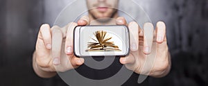 Digital book on smartphone display - E-library concept