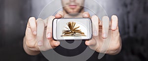 Digital book on smartphone display - E-library concept