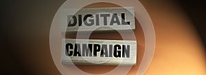 Digital Campaign written on wood blocks on red. Online business concept