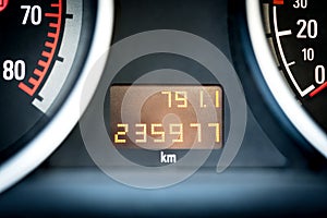 Digital car odometer in dashboard. Used vehicle with mileage meter.