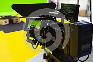 Digital cinema camera in a green screen studio