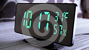 Digital Clock Showing Time on Green Display 10:17 AM, Temperature, Air Humidity