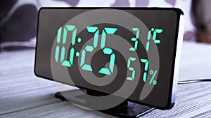 Digital Clock Showing Time on Green Display 10:25 AM, Temperature, Air Humidity