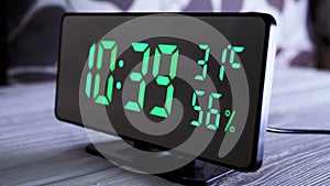 Digital Clock Showing Time on Green Display 10:39 AM, Temperature, Air Humidity