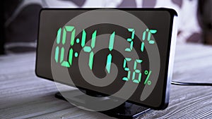 Digital Clock Showing Time on Green Display 10:41 AM, Temperature, Air Humidity