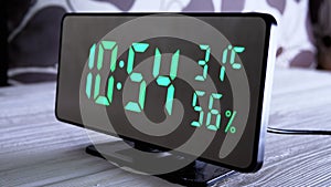 Digital Clock Showing Time on Green Display 10:54 AM, Temperature, Air Humidity