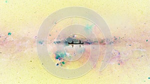 Digital collage of a canoe boat floating in inverted space on `Peony Nebula`. Abstract dreamy concept, digital art of boating an