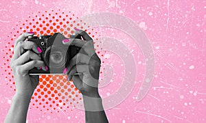 Digital collage with female hands holding vintage film camera on pink background with copy space