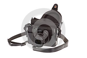 Digital compact camera with black leather case, isolated on white