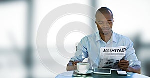 Business man having a coffee against blue and white blurred background