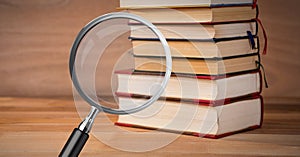 3D Magnifying glass over books