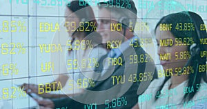 Digital composite of data processing over smiling, multi-ethnic call centre workers.