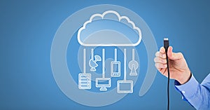 Hand holding wire connection with cloud devices