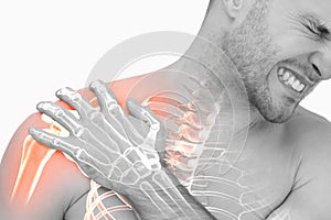 Digital composite of highlighted shoulder pain of man