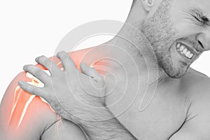 Digital composite of highlighted shoulder pain of man