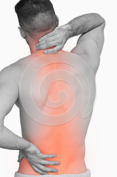 Digital composite of highlighted spine of man with back pain