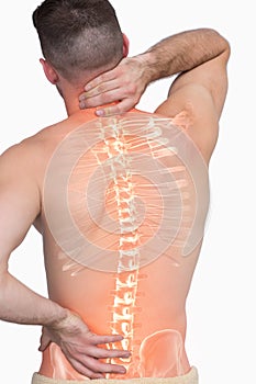 Digital composite of highlighted spine of man with back pain