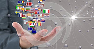 Digital composite image of business hand with flags and connecting dots