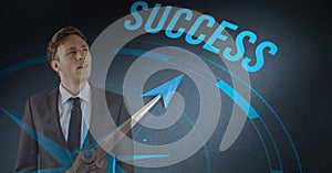 Digital composite image of businessman standing by success text with compass