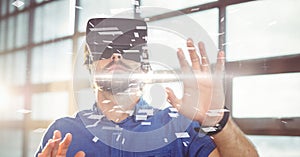Digital composite image of businessman wearing VR glasses