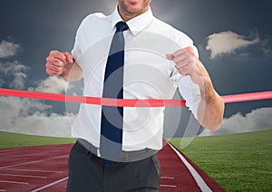 Digital composite image of a businessman winning the race