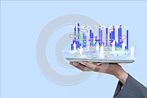 Digital composite image of employees and graphs overs tablet computer held by businessman against bl