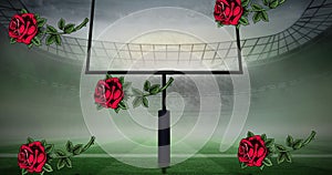 Digital composite image of falling red roses against goal post on american football field