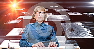 Digital composite image of hacker with screens