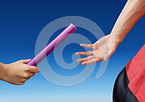 Digital composite image of hands passing the baton photo