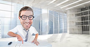 Digital composite image of happy nerd using computer keyboard