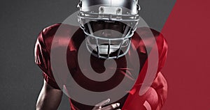 Digital composite image of male american footballer wearing helmet holding ball over background