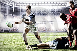 Digital composite image of team of rugby players playing rugby in sports stadium