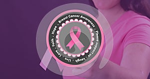 Digital composite image of woman with pink ribbon and breast cancer awareness slogan