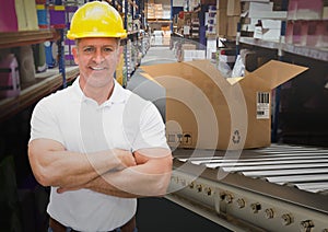 man with boxes on conveyor belt in warehouse