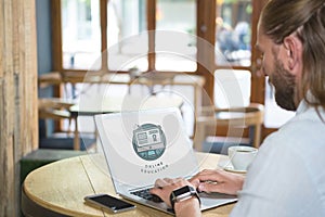 Man using a computer with e-learning information in the screen