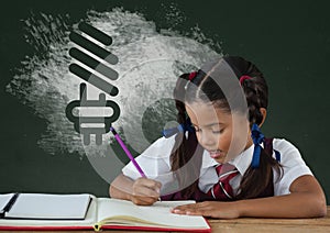 Student girl at table writing against green blackboard with school and education graphic