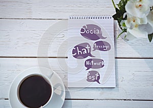 Table top with a notebook with web graphics