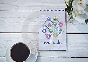 Table top with a notebook with web graphics