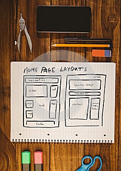 Table top with a notebook with web graphics