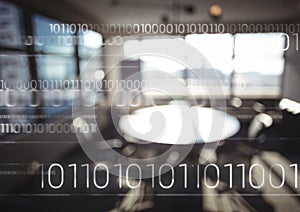 White binary code against blurry office