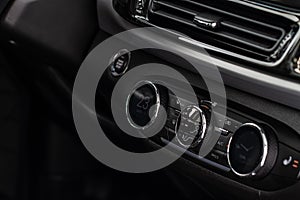 Digital control panel car air conditioner dashboard. Modern car interior conditioning buttons inside a car close up view.