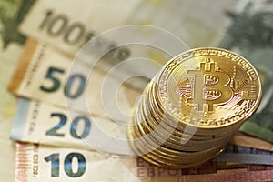 Digital currency bitcoin and euro banknotes