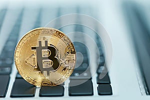 Digital Currency. Bitcoin On Keyboard Closeup