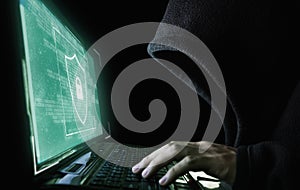 Digital data security system and protection. Anonymous hacker try to hacking on computer laptop