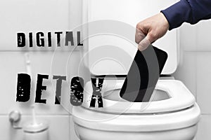 Digital detox inscription, refusal of the phone. a man's hand throws the phone into the toilet because of a breakdown or