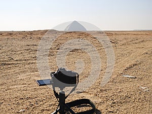 A digital DSLR camera on a tripod Photographing the Bent Pyramid of king Sneferu, A unique example of early pyramid development in