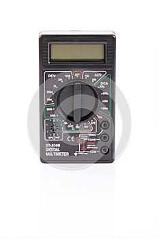 Digital electrical tester multimeter in black case isolated on white background. Digital multimeters have a numeric display, can