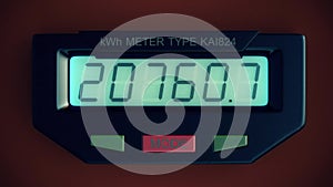 Digital electricity meter showing household consumption in kilowatt hours