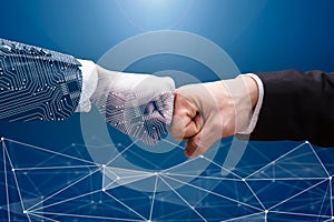 Digital Generated Human Hand And Businessman Making Fist Bump