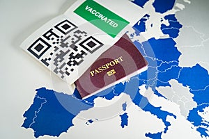 Digital green passport with QR code over an EU map photo